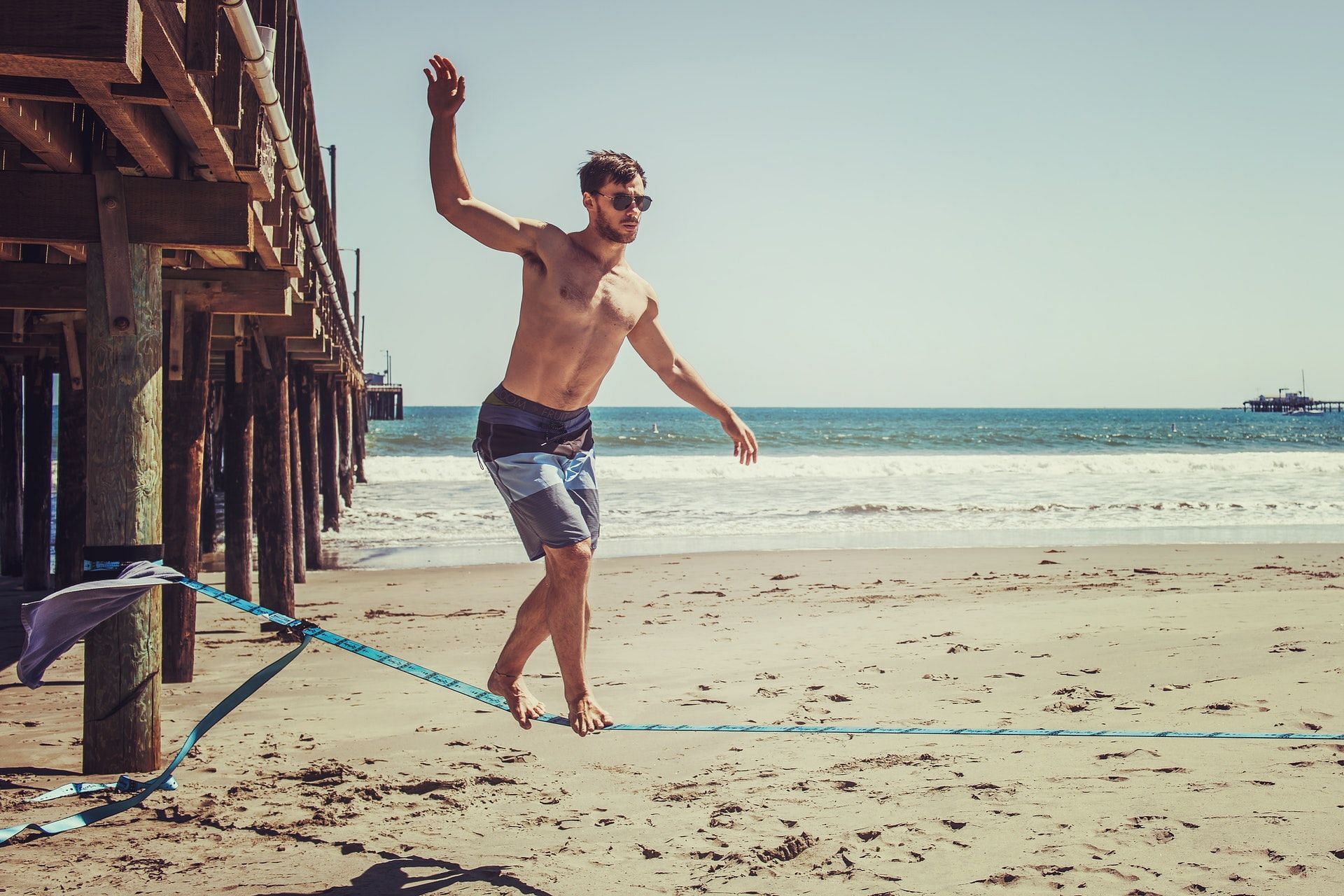 There are many balance exercises you can do using a slackline. (Photo by Tim Mossholder via pexels)