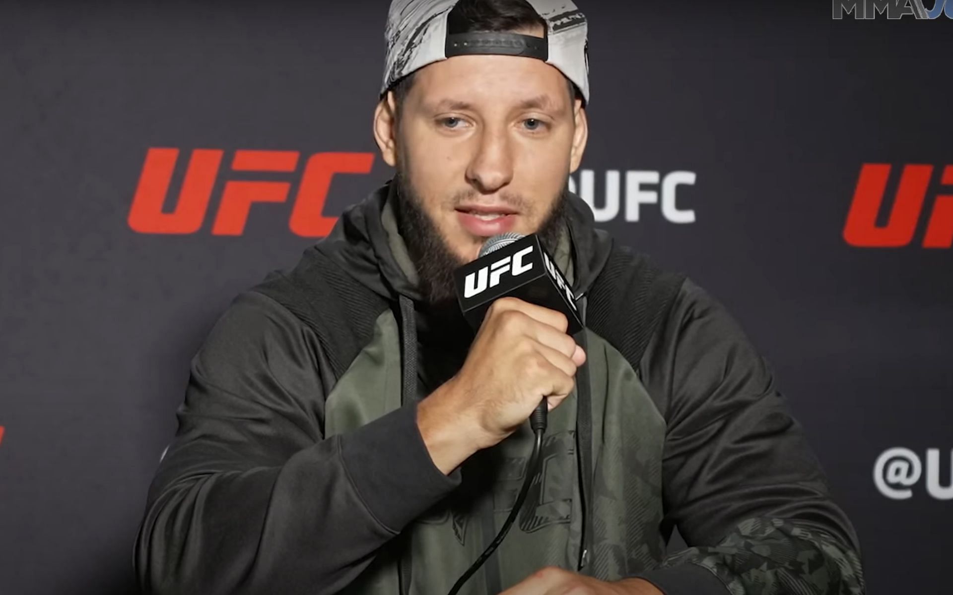 Askar Mozharov at a UFC press conference before his debut [Image courtesy MMA Junkie YouTube]