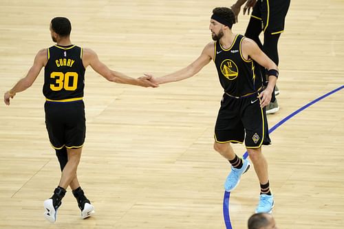 Dallas Mavericks v Golden State Warriors; Steph Curry and Klay Thompson celebrate