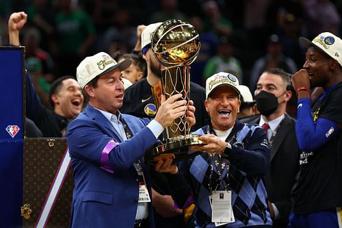 Joe Lacob lifts the Larry O'Brien Trophy after the Warriors won the 2022 NBA Finals.