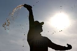 Which NASCAR driver holds the record of most wins in all three national series in the same season?