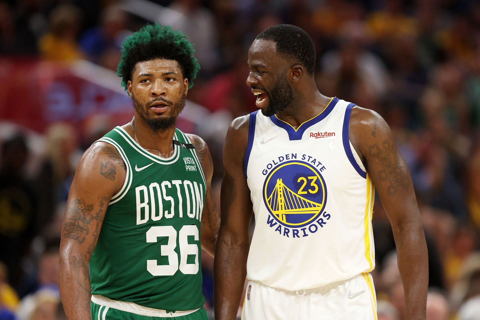 Marcus Smart, left, and Draymond Green, right