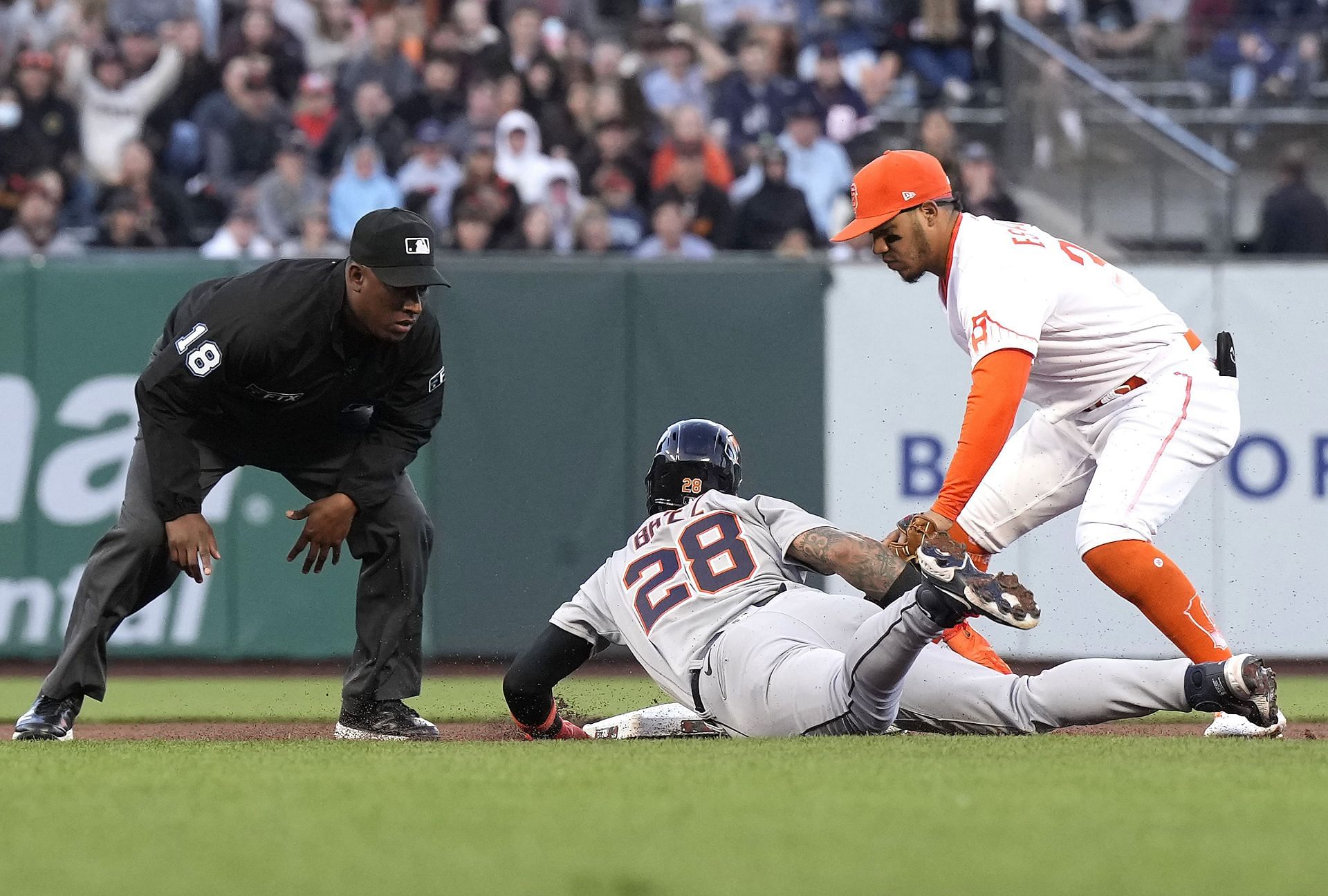 San Francisco Giants infielder Thairo Estrada tags out Detroit Tigers star Javier Baez.