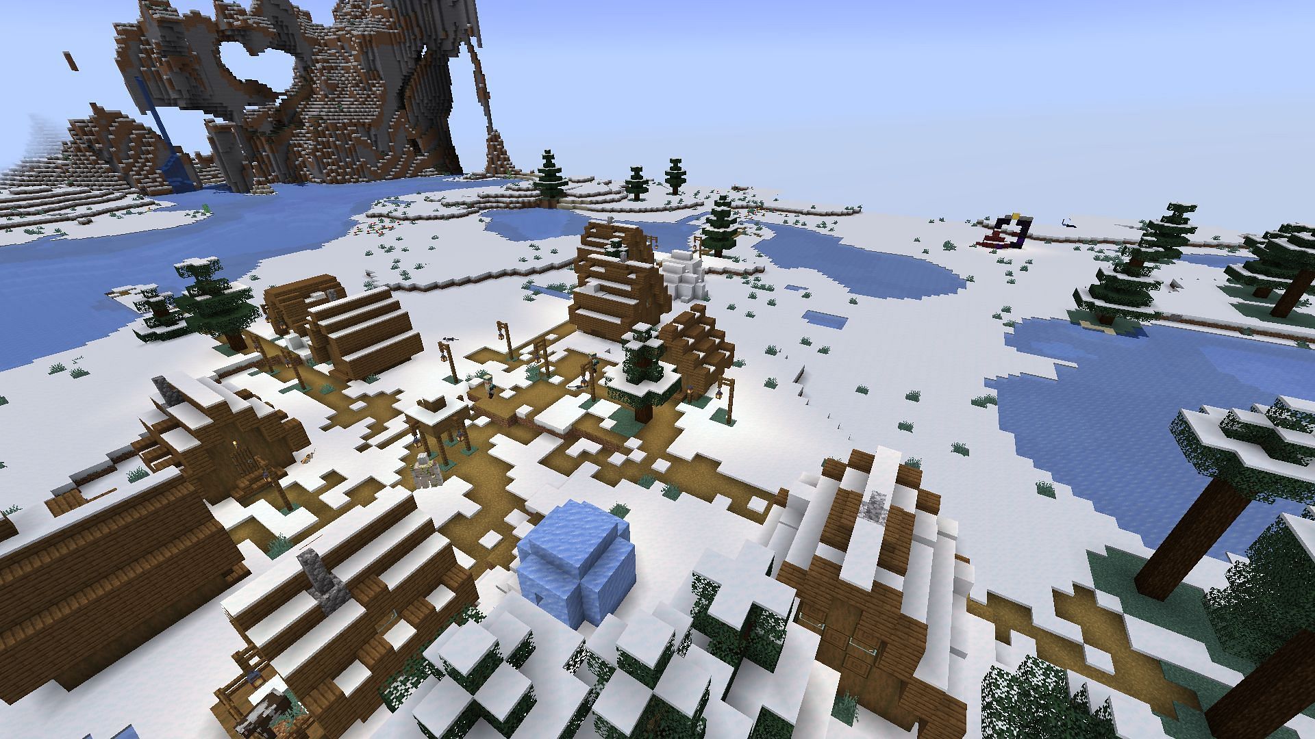 The snowy village and ruined portal near spawn (Image via Minecraft)