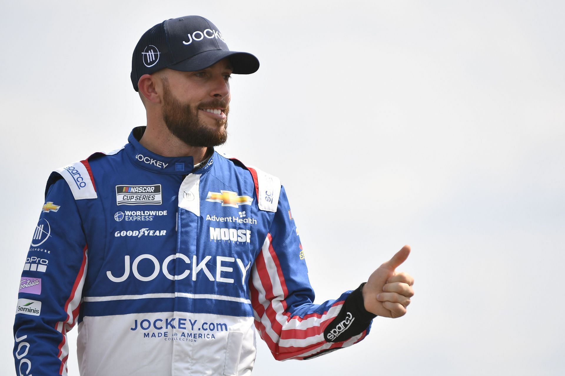 Ross Chastain gives a thumbs up to fans onstage during driver intros prior to the NASCAR Cup Series Ally 400 at Nashville Superspeedway (Photo by Logan Riely/Getty Images)