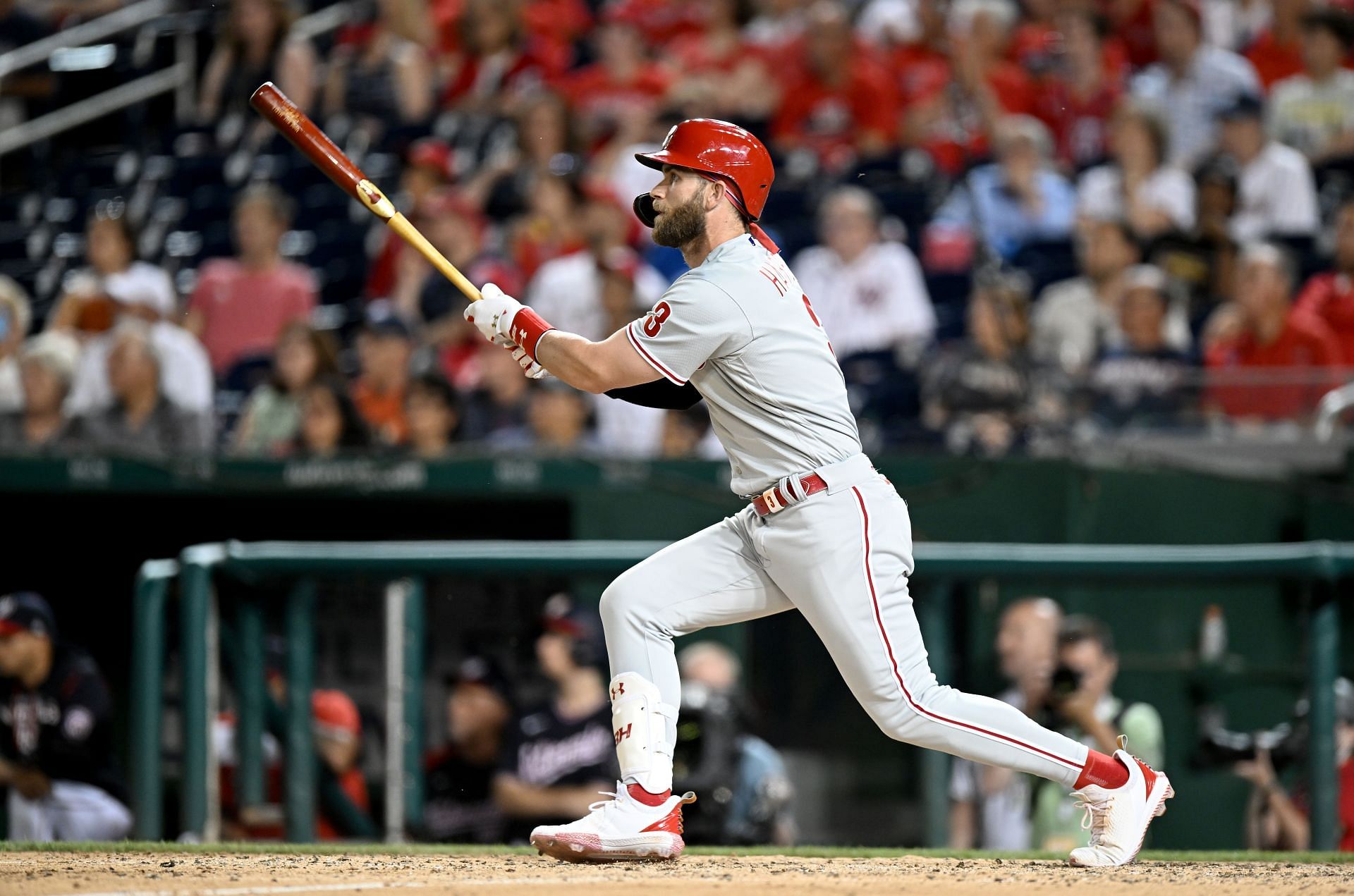Bryce Harper of the Philadelphia Phillies drives in two runs with a double in the eighth inning against the Washington Nationals.