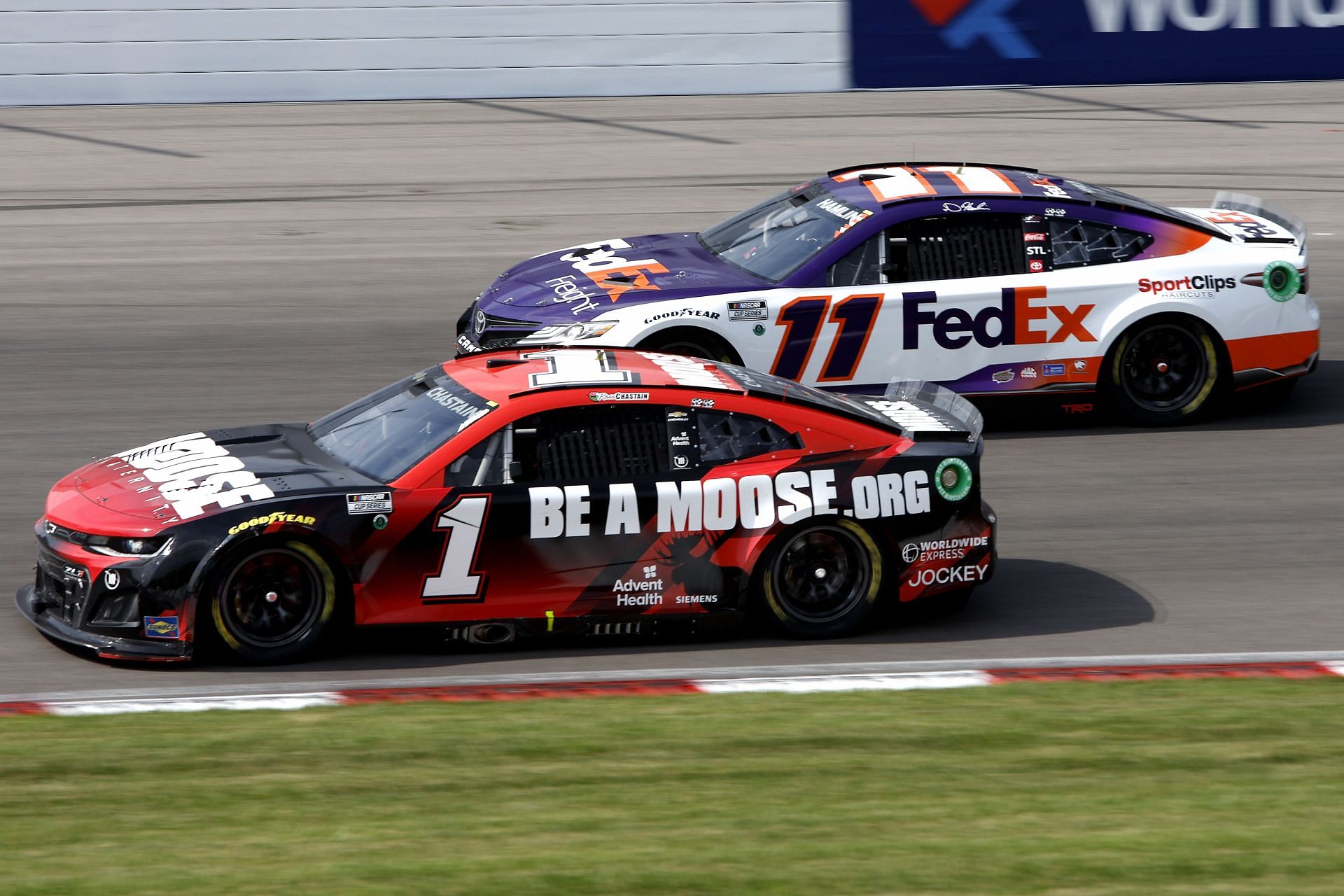 Ross Chastain (#1) and Denny Hamlin (#11) race during the NASCAR Cup Series Enjoy Illinois 300 at WWT Raceway