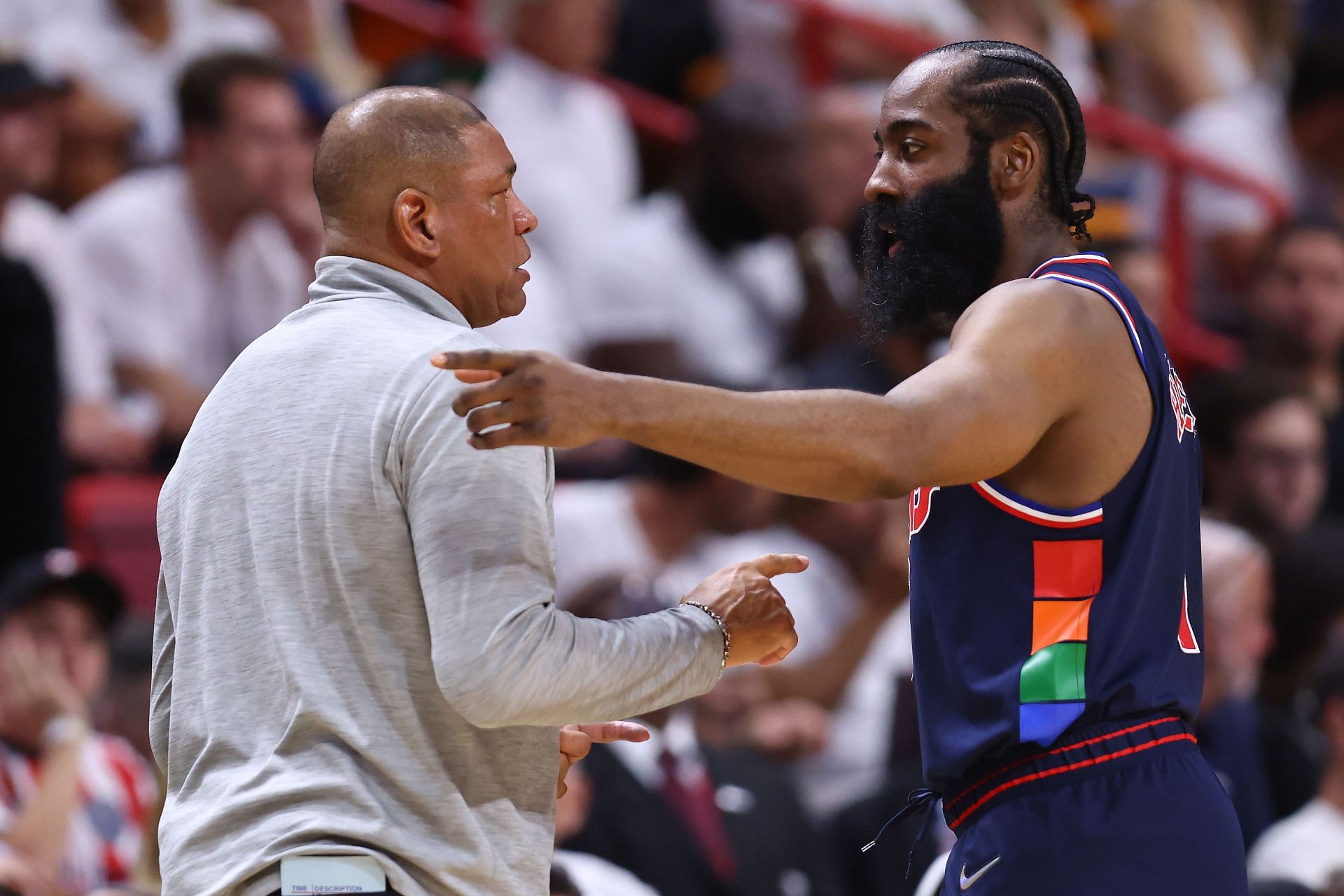 James Harden #1 of the Philadelphia 76ers talks with head coach Doc Rivers against the Miami Heat during the first half in Game Five of the Eastern Conference Semifinals at FTX Arena on May 10, 2022 in Miami, Florida.