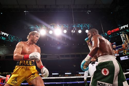 Logan Paul (L) fought Floyd Mayweather (R) one year ago today.