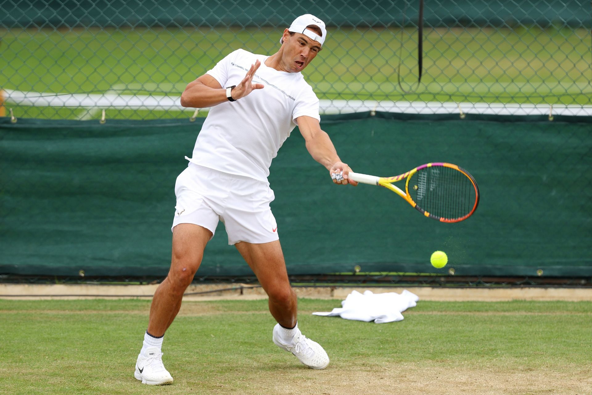 Rafael Nadal plays a forehand at Wimbledon