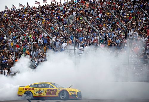 Joey Logano celebrates with a burnout after winning the NASCAR Cup Series Enjoy Illinois 300 at WWT Raceway (Photo by Sean Gardner/Getty Images)