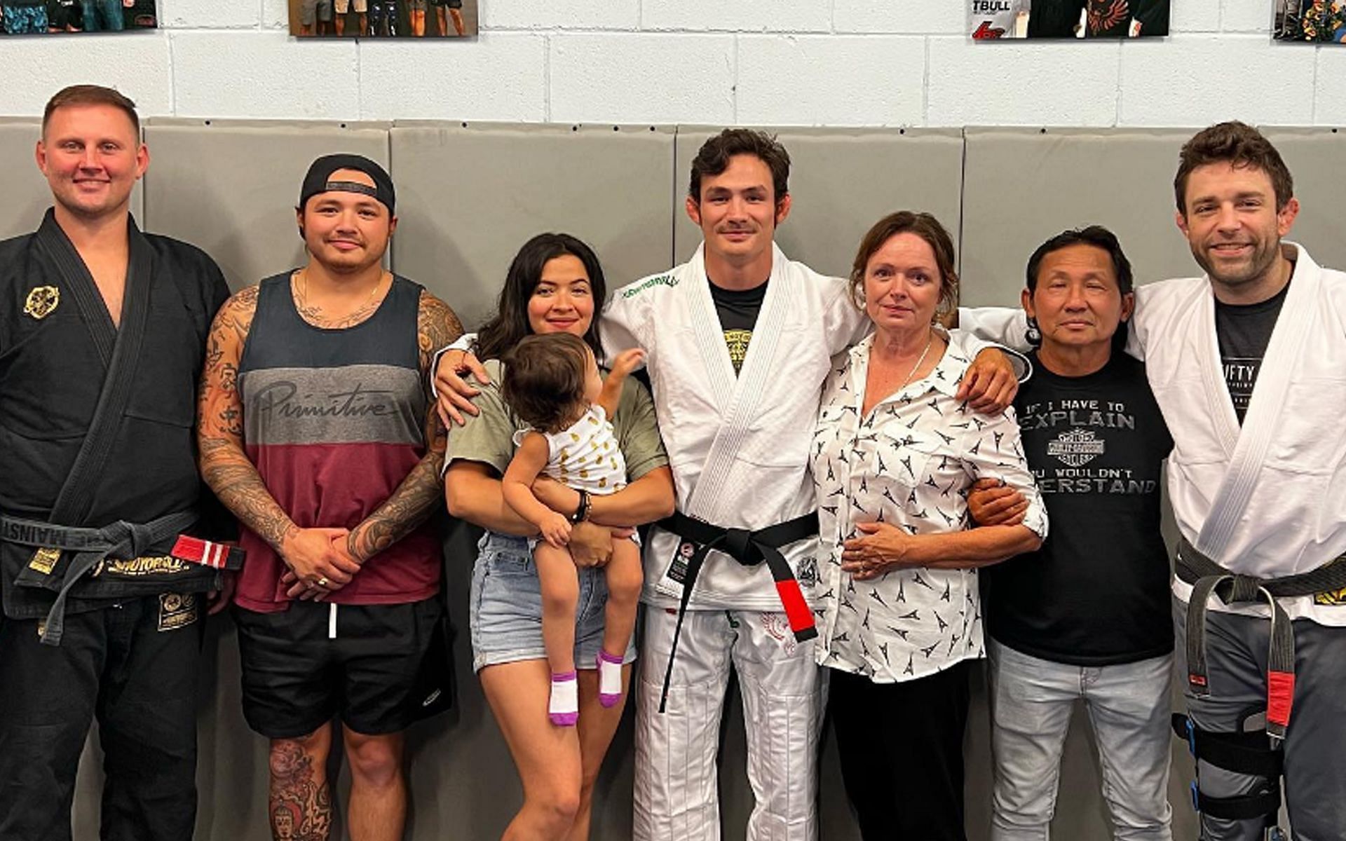 Thanh Le (C) is flanked by family and friends, including Ryan Hall (R), who awarded him his BJJ black belt. | [Photo: @thanhlemma on Instagram]