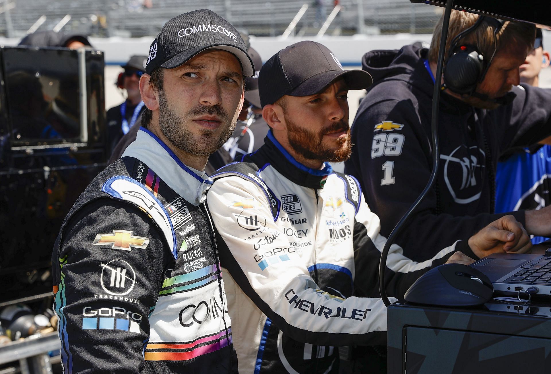 Daniel Suarez (L) and Ross Chastain (R) wait on the grid during qualifying for the DuraMAX Drydene 400 presented by RelaDyne at Dover Motor Speedway