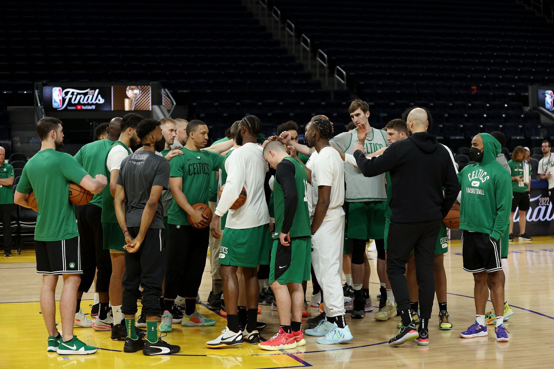 Coach Ime Udoka huddles the team together on 2022 NBA Finals Media Day