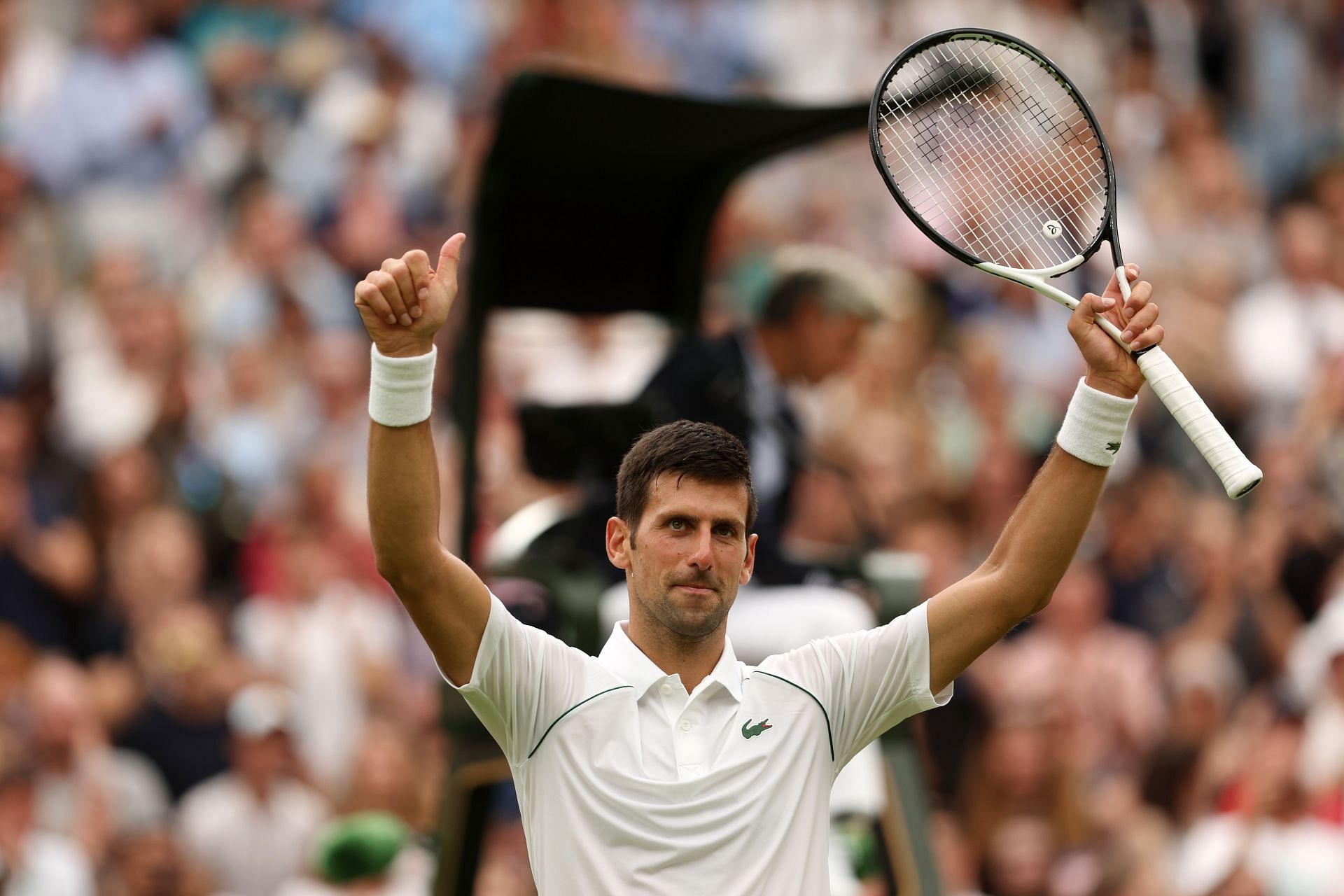 Novak Djokovic celebrates after getting through his first-round match at Wimbledon 2022