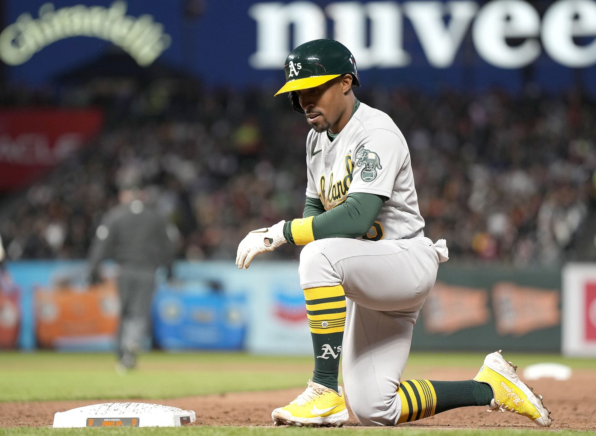 Tony Kemp of the Oakland Athletics kneels at first base after he was picked off