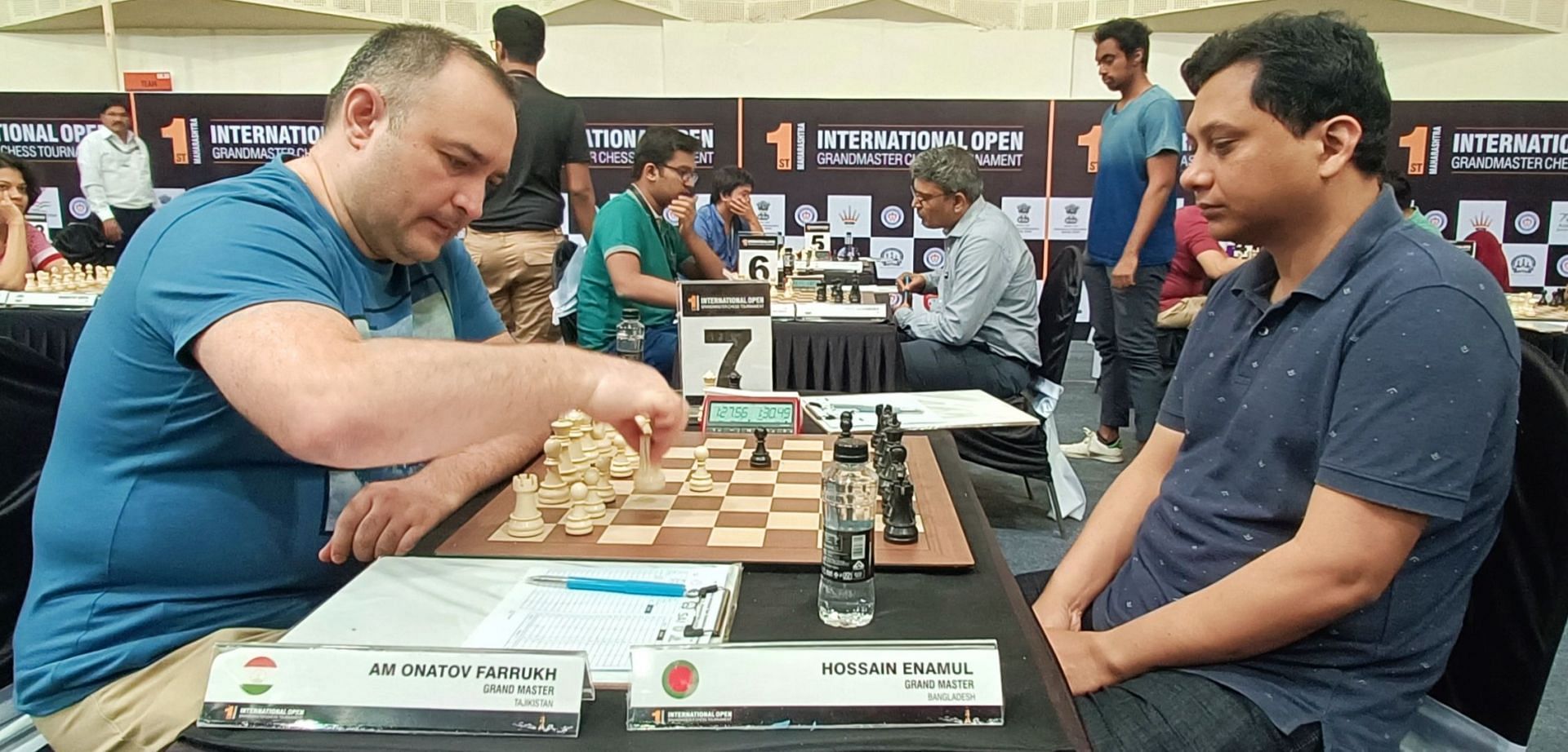 GM Farrukh Amonatov (L) playing against GM Enamul Hossain in the fifth round in Pune on Friday. (Pic credit: AICF)