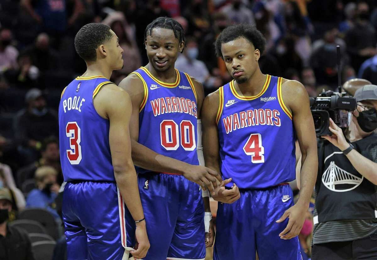 (L-R) Jordan Poole, Jonathan Kuminga and Moses Moody of the Golden State Warriors in the 2021-22 NBA season [Source: SF Chronicle]