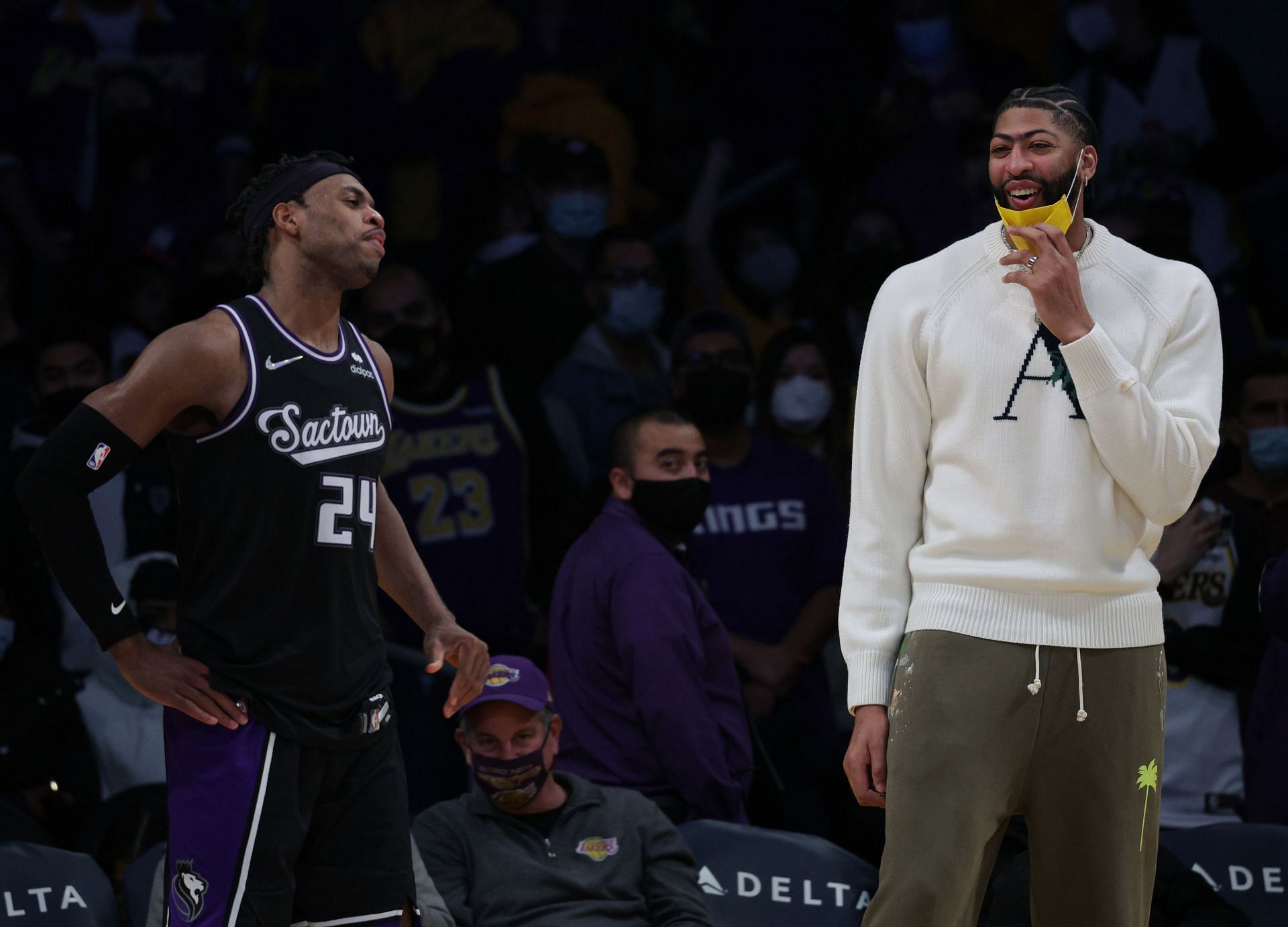 Anthony Davis of the LA Lakers laughs with Buddy Hield of the Sacramento Kings