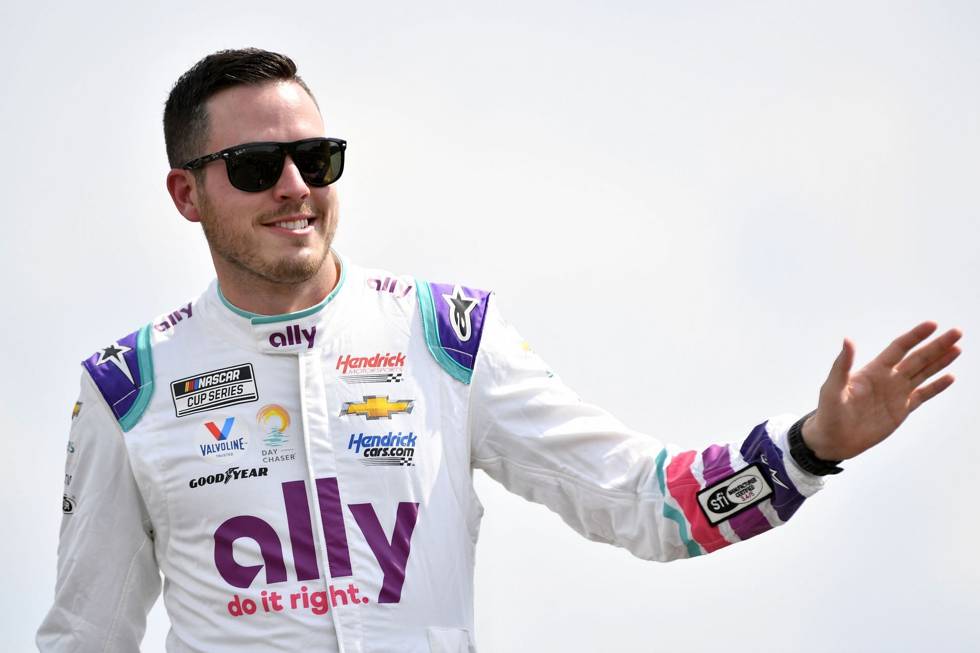 Alex Bowman waves to fans onstage during driver intros before the 2022 NASCAR Cup Series Ally 400 at Nashville Superspeedway in Lebanon, Tennessee (Photo by Logan Riely/Getty Images)