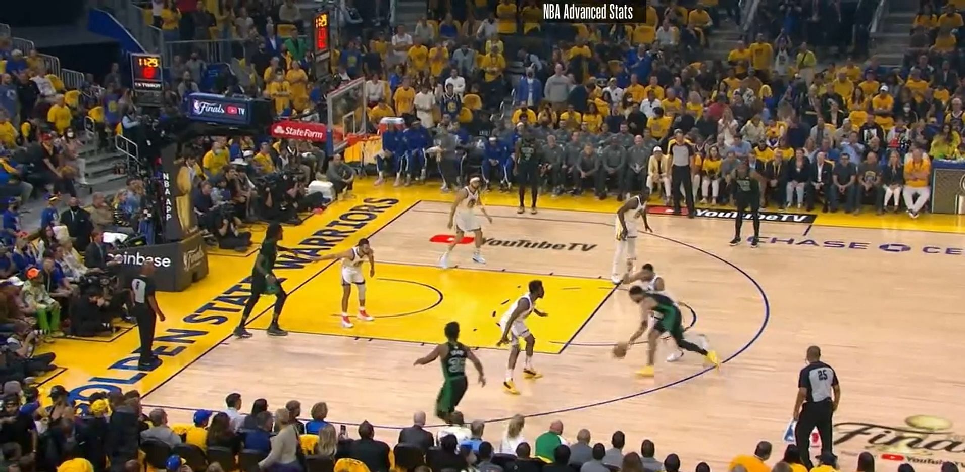 Forced to dribble with his left hand, Tatum drives into the paint.