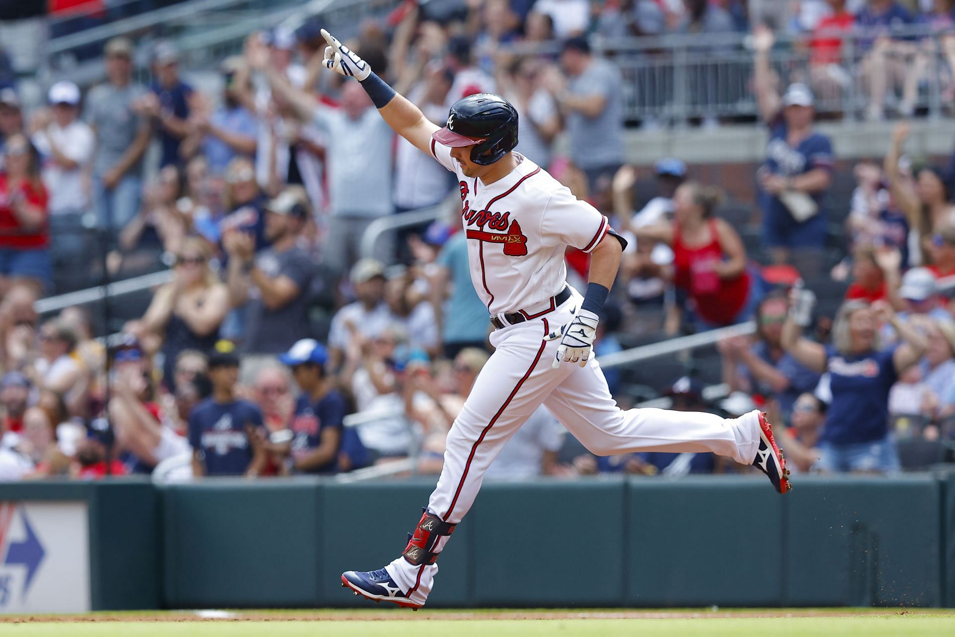 Adam Duvall rounds the bases after a home run.