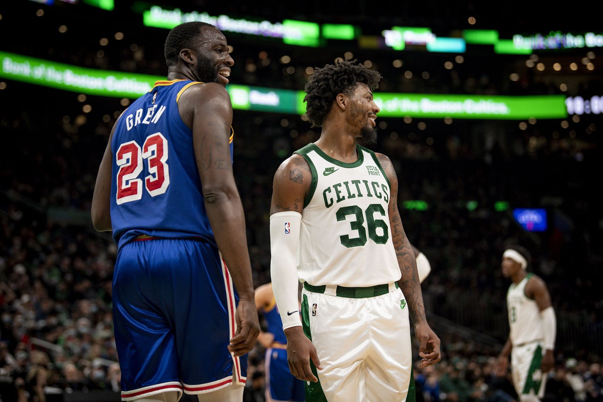 Draymond Green of the Golden State Warriors and Marcus Smart of the Boston Celtics