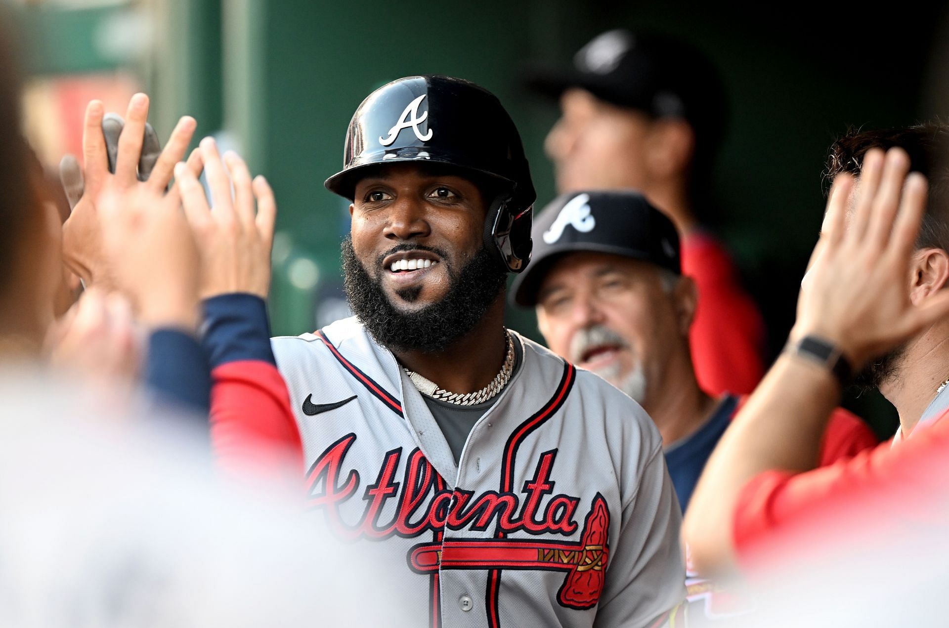 Marcell Ozuna is congratulated by teammates after a home run during Tuesday&#039;s Braves v Nationals game.