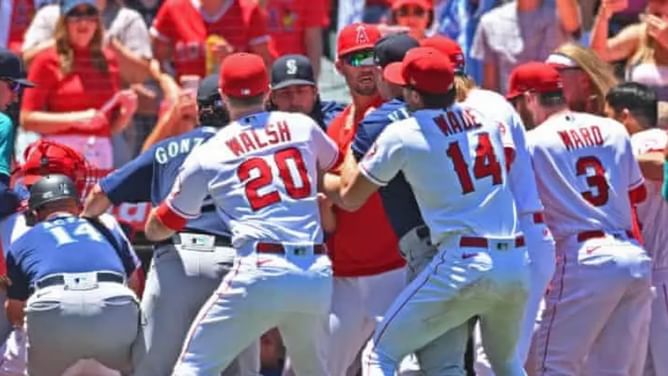 Watch: Los Angeles Angels Raisel Iglesias launches a box of sunflower seeds following bench-clearing brawl with Seattle Mariners