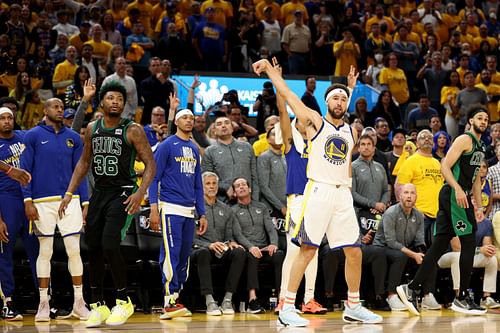 Klay Thompson reacts to shooting a three-pointer