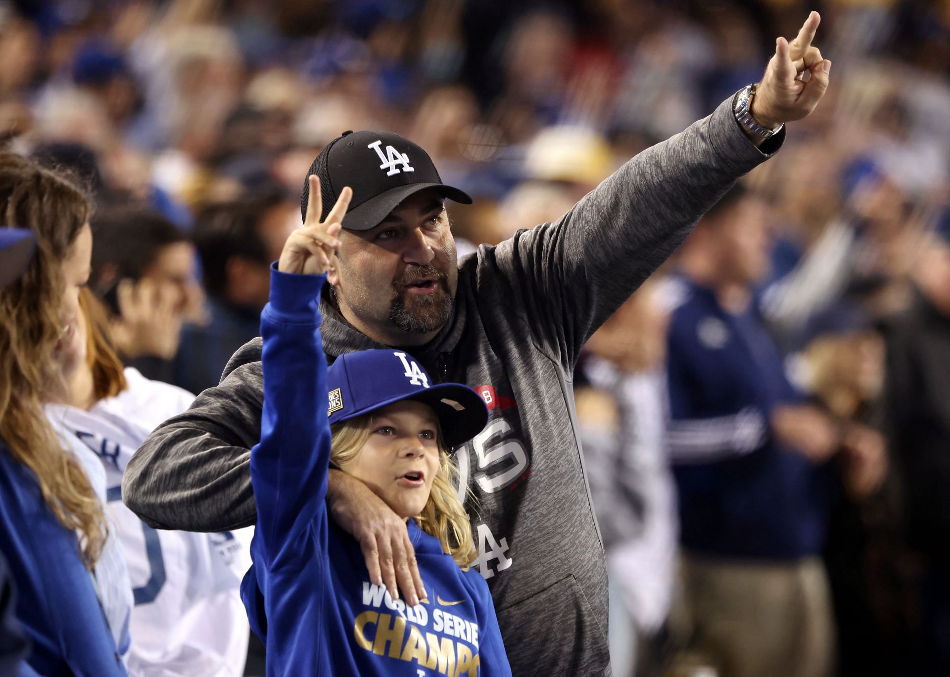 Fans cheer on the Los Angeles Dodgers at a game against teh New York Mets.