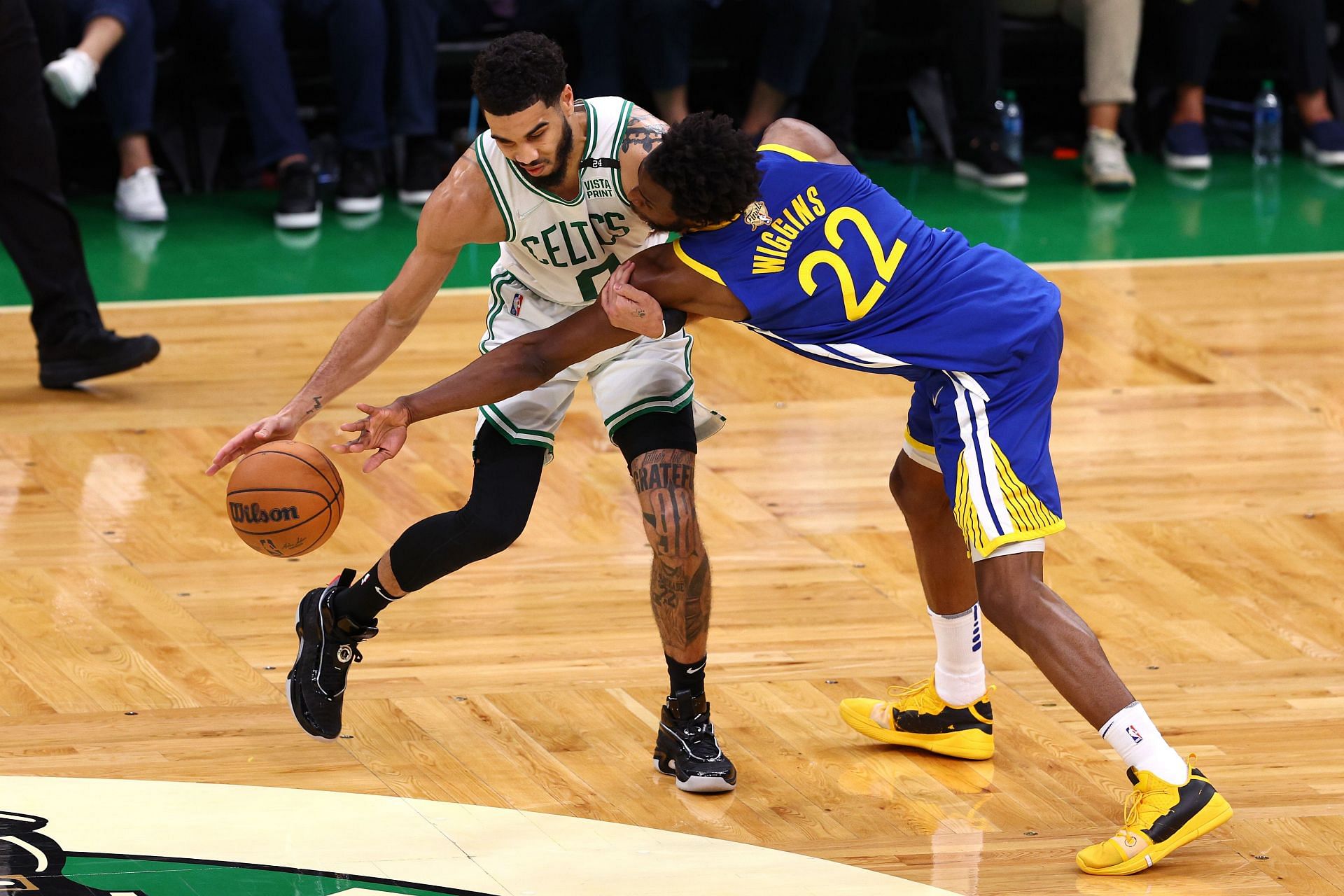 Jayson Tatum being guarded by Andrew Wiggins.