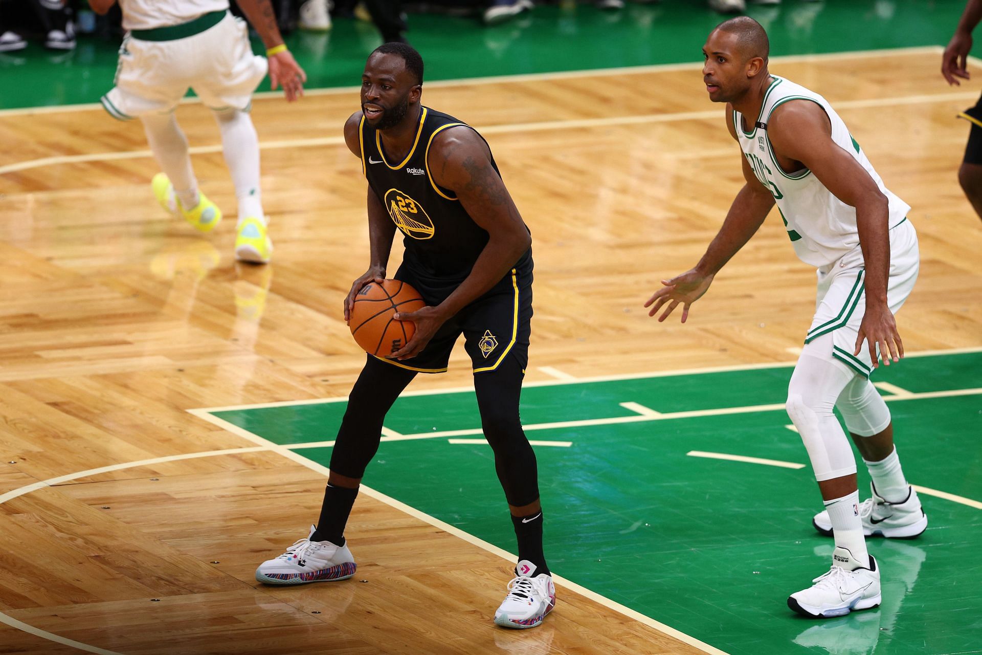 Draymond Green looks to make a pass.