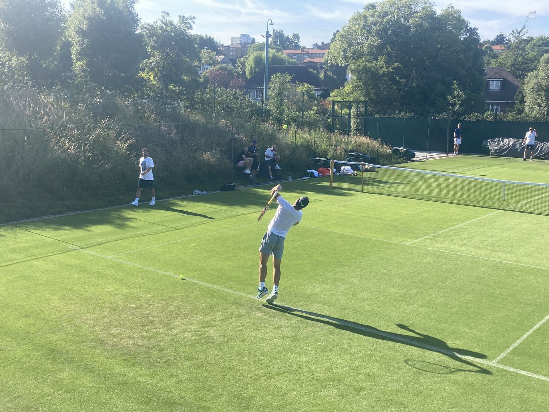 The Spaniard serves during his practice session