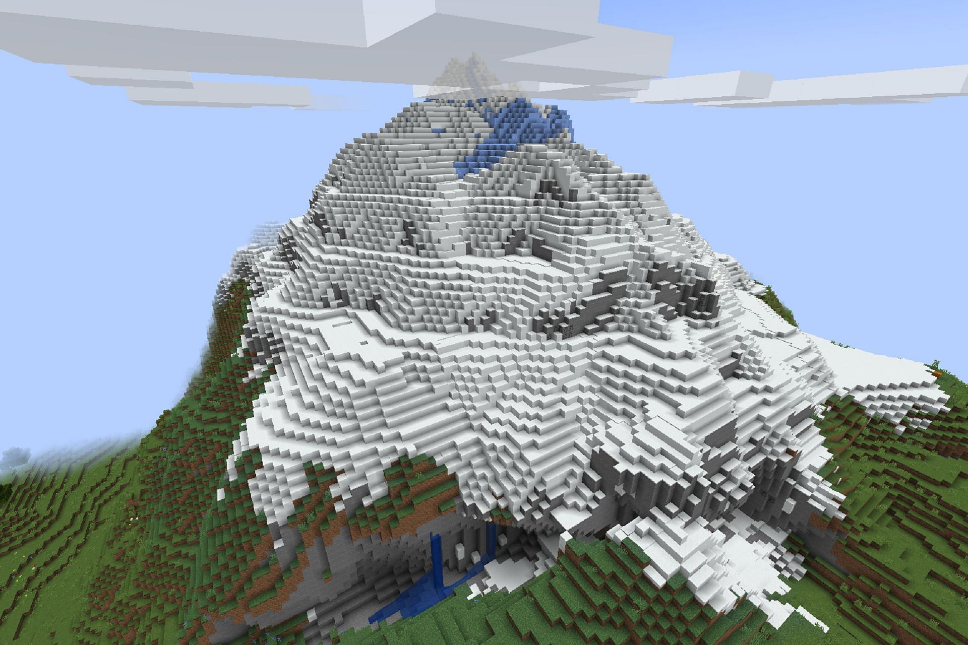 This gorgeous mountain is complete with many structures (Image via Mojang)