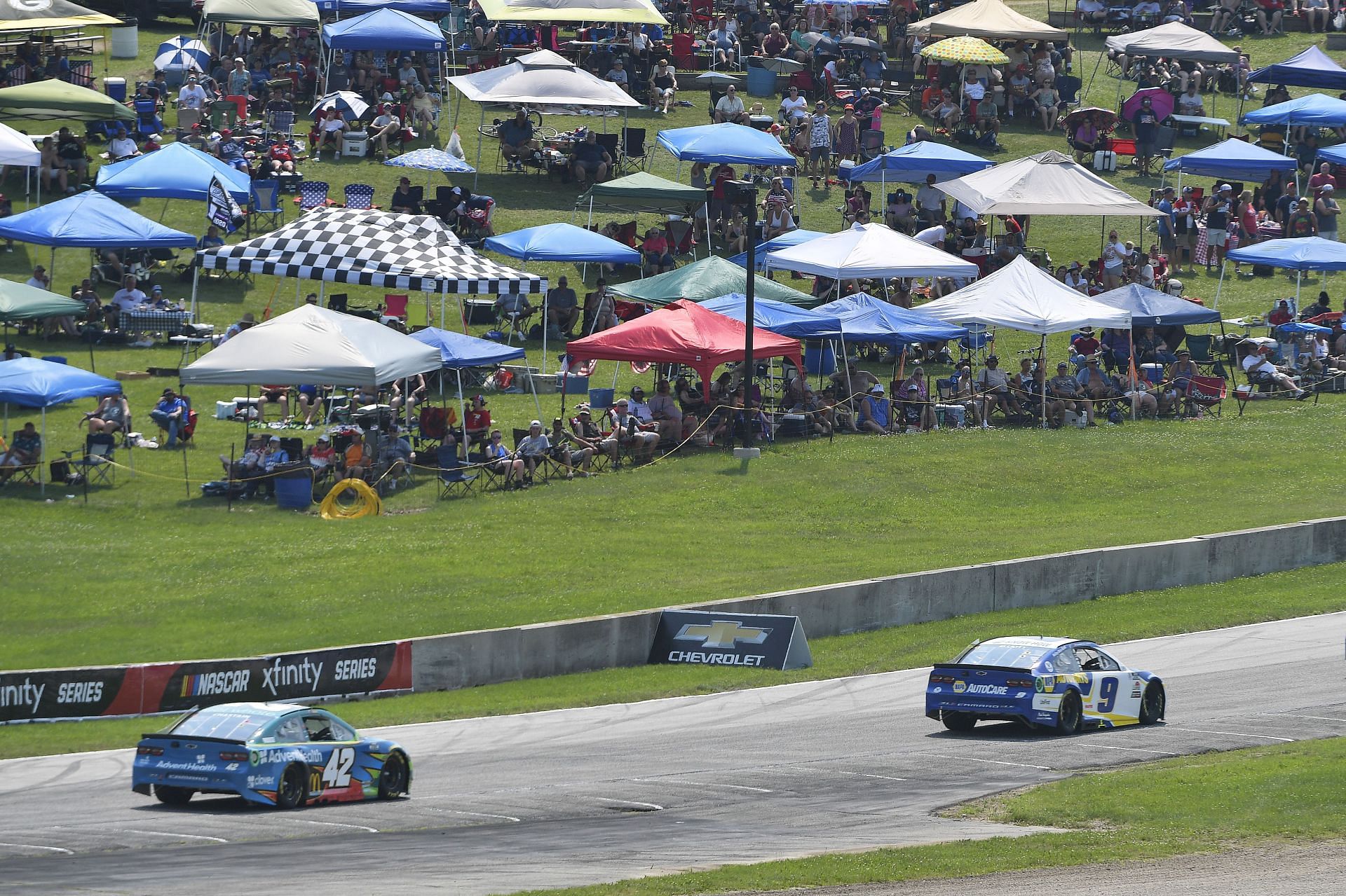 A general view of fans on a grassy field and under canopies watching the NASCAR Cup Series Jockey Made in America 250 Presented by Kwik Trip at Road America (Photo by Logan Riely/Getty Images)