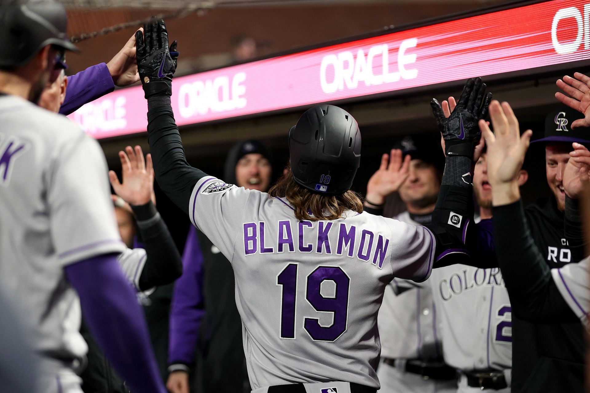 Charlie Blackmon celebrates in the dugout during a Colorado Rockies v San Francisco Giants game.