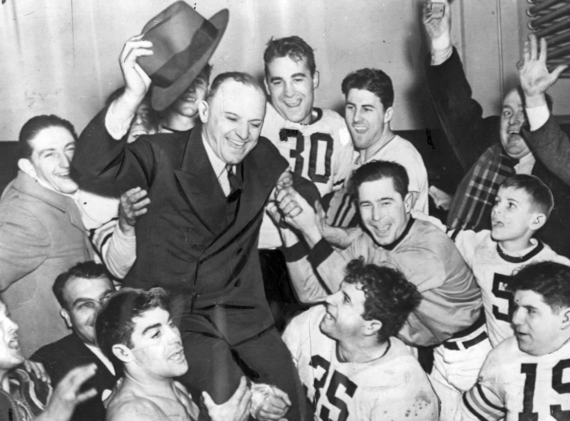 George Halas and his Chicago team celebrate a 73-0 win