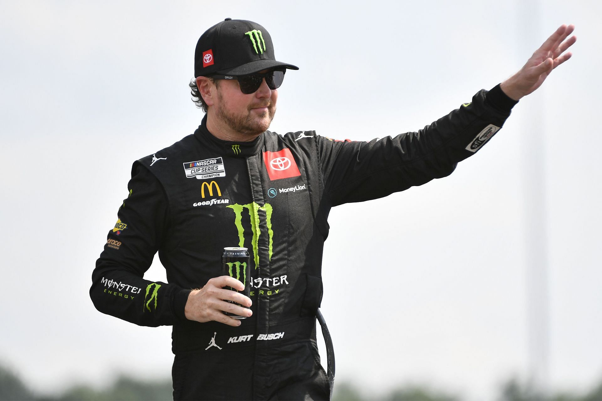 Kurt Busch waves to fans onstage during driver intros before the NASCAR Cup Series Ally 400 at Nashville Superspeedway