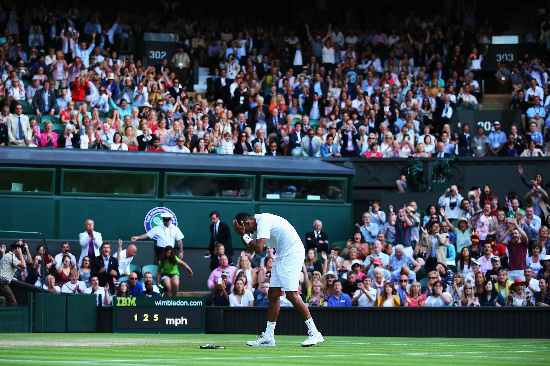 Nick Kyrgios celebrates his win against Rafael Nadal at Wimbledon 2014