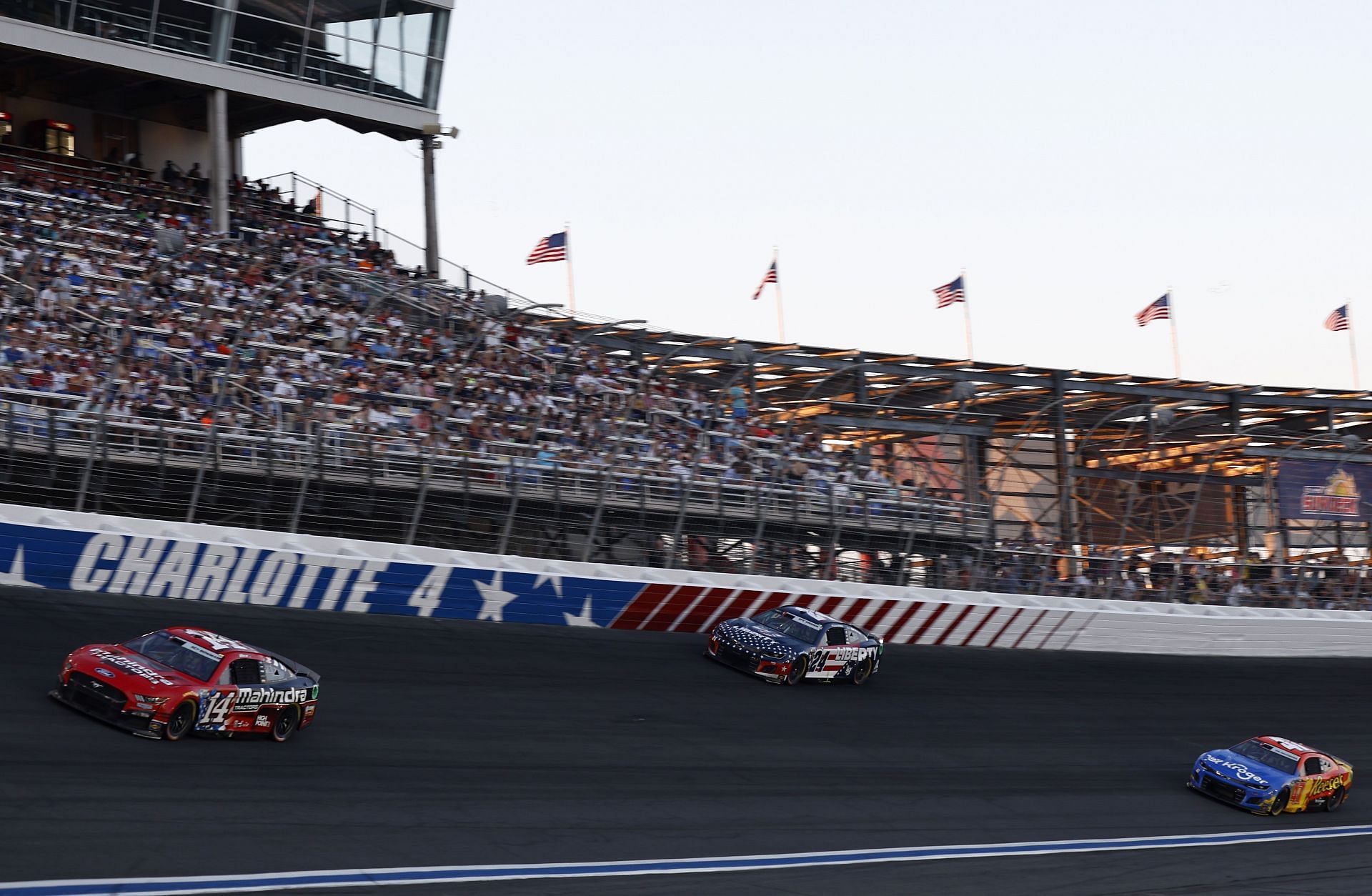 Chase Briscoe, William Byron, and Ricky Stenhouse Jr. race during the NASCAR Cup Series Coca-Cola 600 at Charlotte Motor Speedway (Photo by Jared C. Tilton/Getty Images)