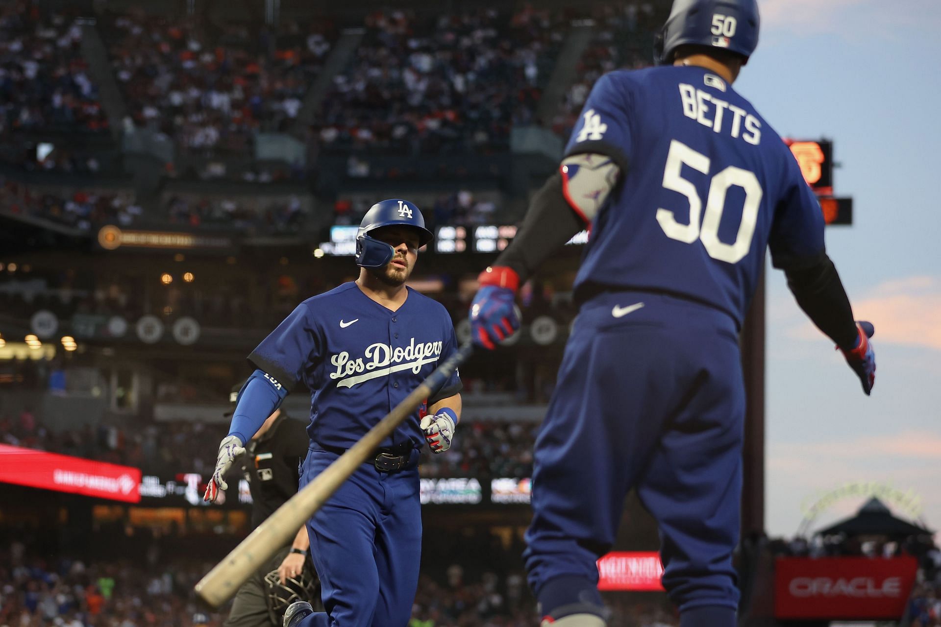 Gavin Lux celebrates with Mookie Betts during a Los Angeles Dodgers v San Francisco Giants game.
