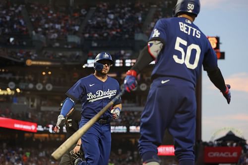 Gavin Lux celebrates with Mookie Betts during a Los Angeles Dodgers v San Francisco Giants game.