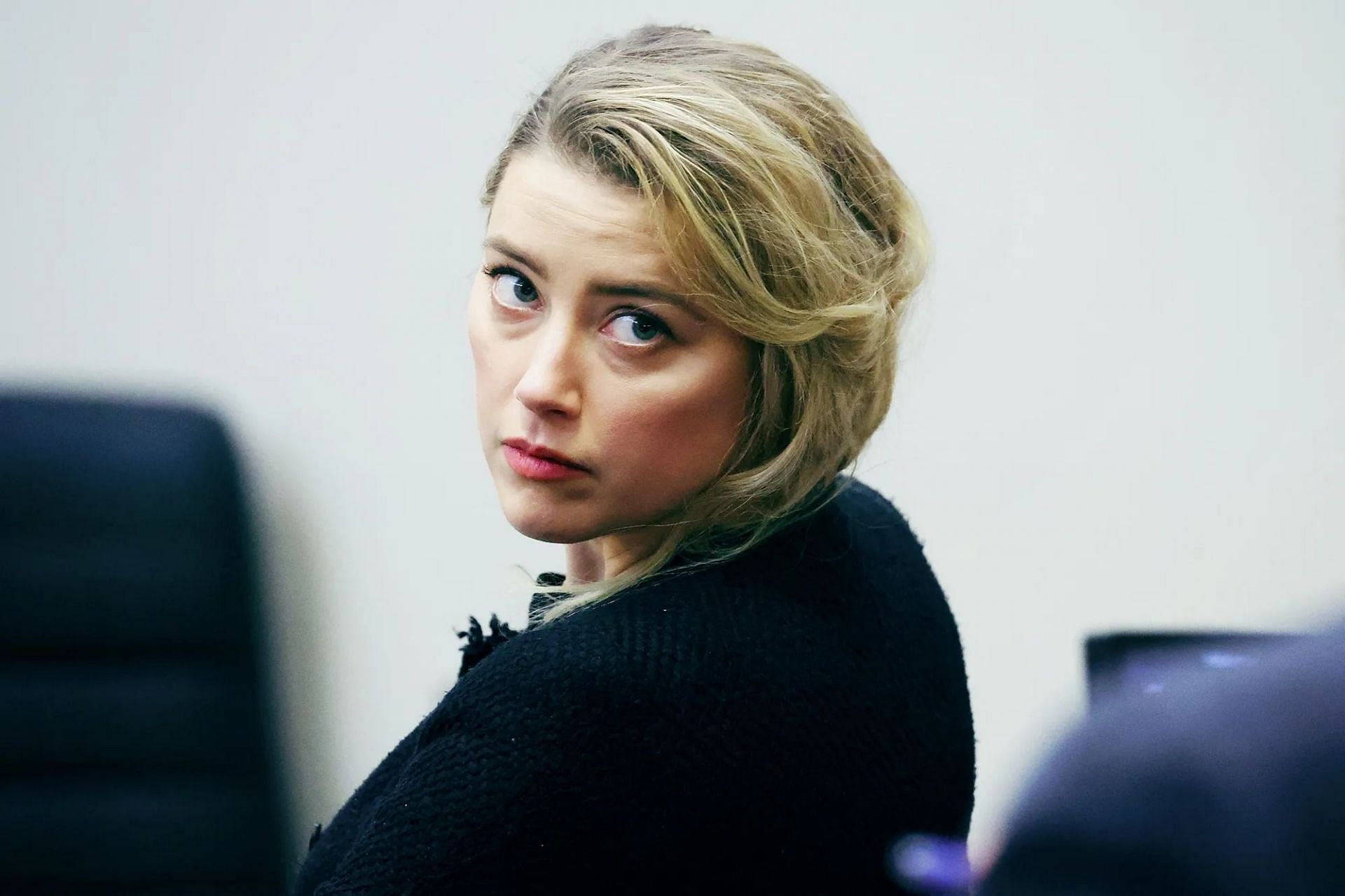 Amber Heard in the trial (Image via Michael Reynolds/Pool/AFP/Getty Images)