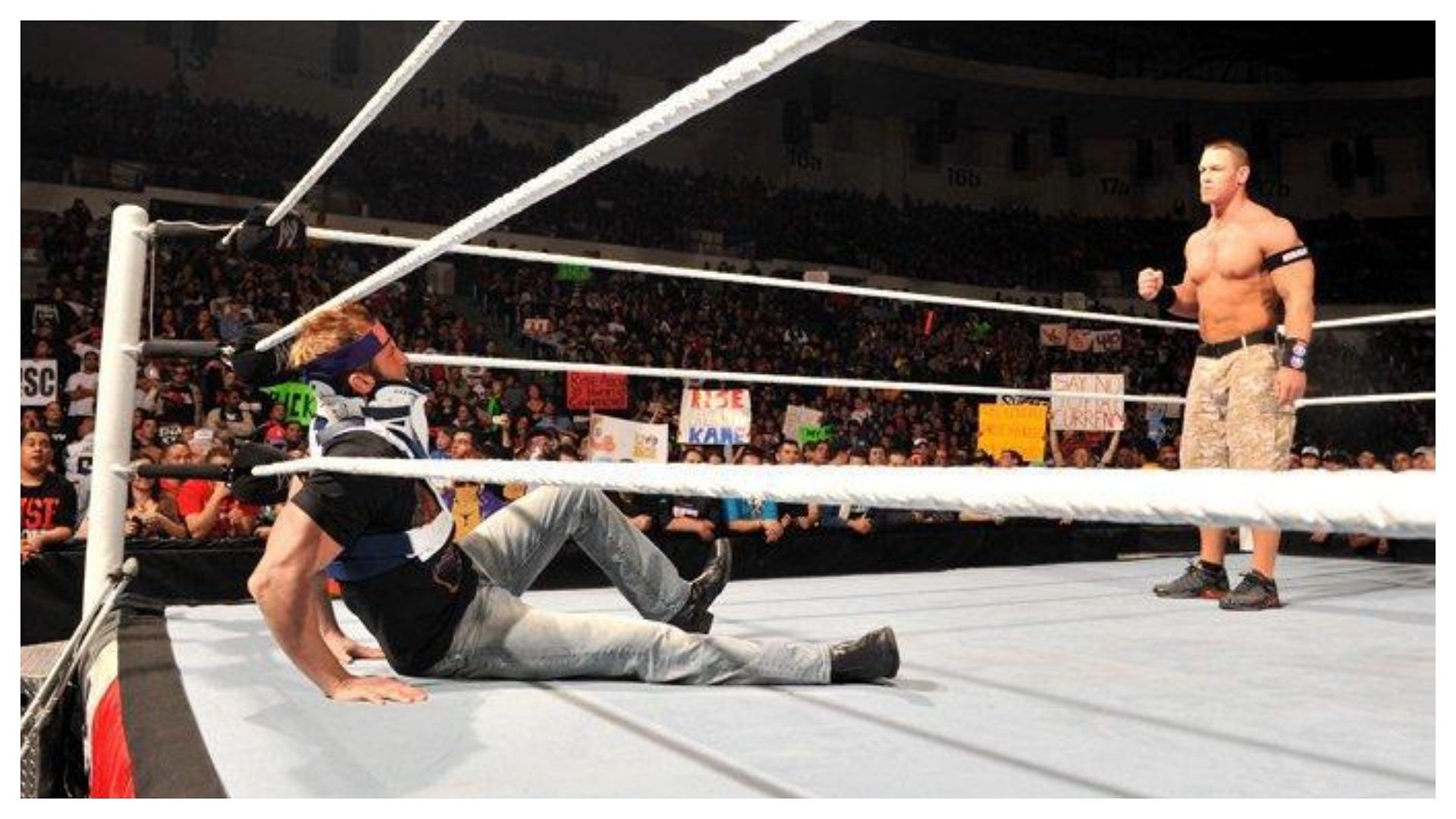 Cena stands over Ryder after shoving him to the canvas!