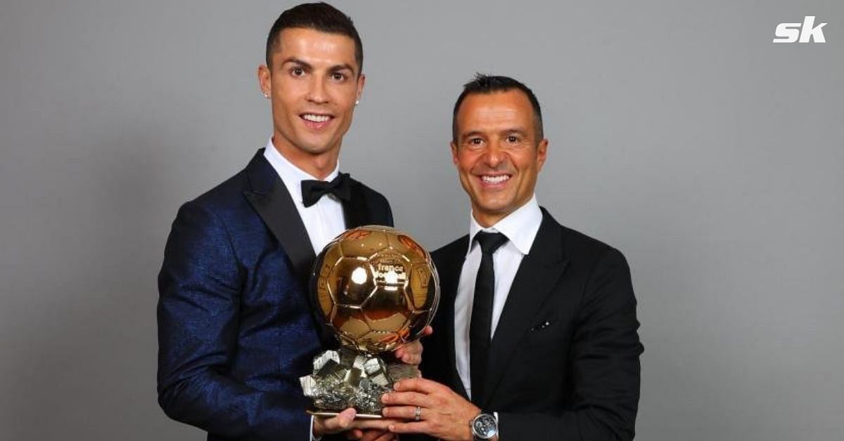 Ronaldo posing alongside Mendes with the Ballon d&#039;Or