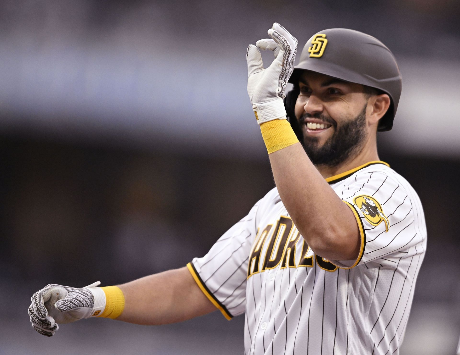 Eric Hosmer of the San Diego Padres gestures after hitting a single.