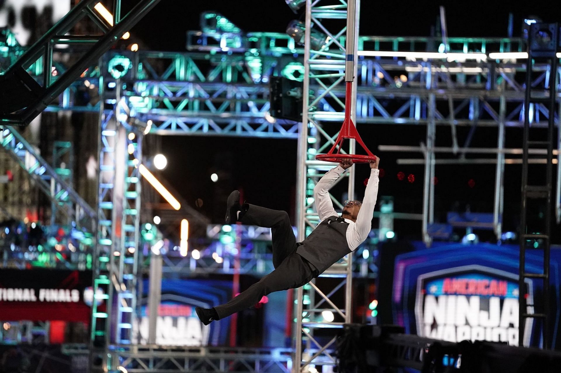 A participant tries to overcome an obstacle in ANW (Image via Facebook/@ninjawarrior)