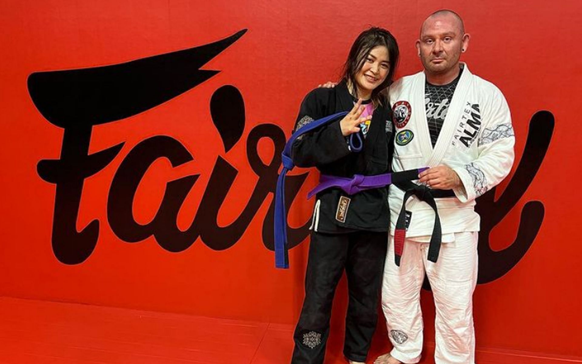 Stamp Fairtex (L) was promoted to purple belt by her mentor, Jason Burnworth (R). | [Photo: @stamp_fairtex on Instagram]