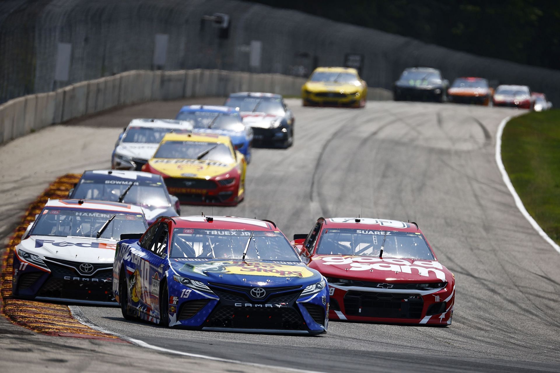 Martin Truex Jr. leads during the 2021 NASCAR Cup Series Jockey Made in America 250 Presented by Kwik Trip at Road America in Elkhart Lake, Wisconsin (Photo by Jared C. Tilton/Getty Images)